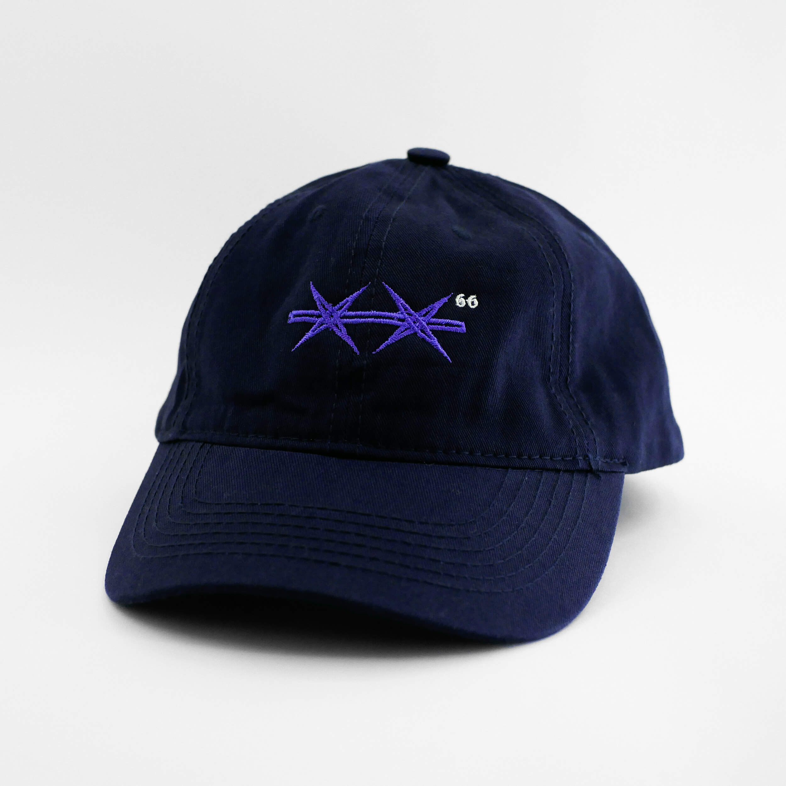 Angle view of the embroidered Barbed Wire navy blue dad hat from PHOSIS Clothing