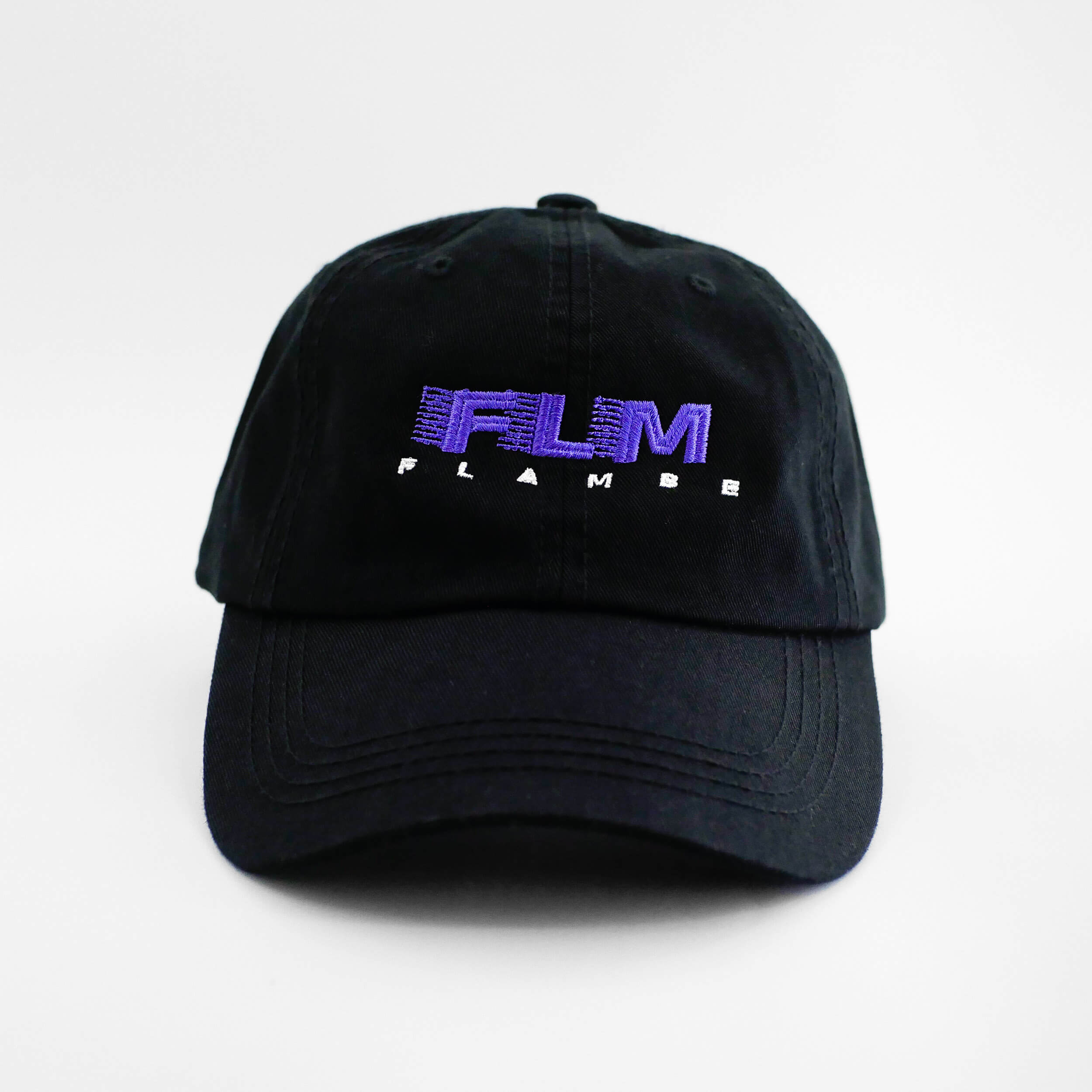 Front view of the embroidered 'FLAMBE' black dad hat from PHOSIS Clothing