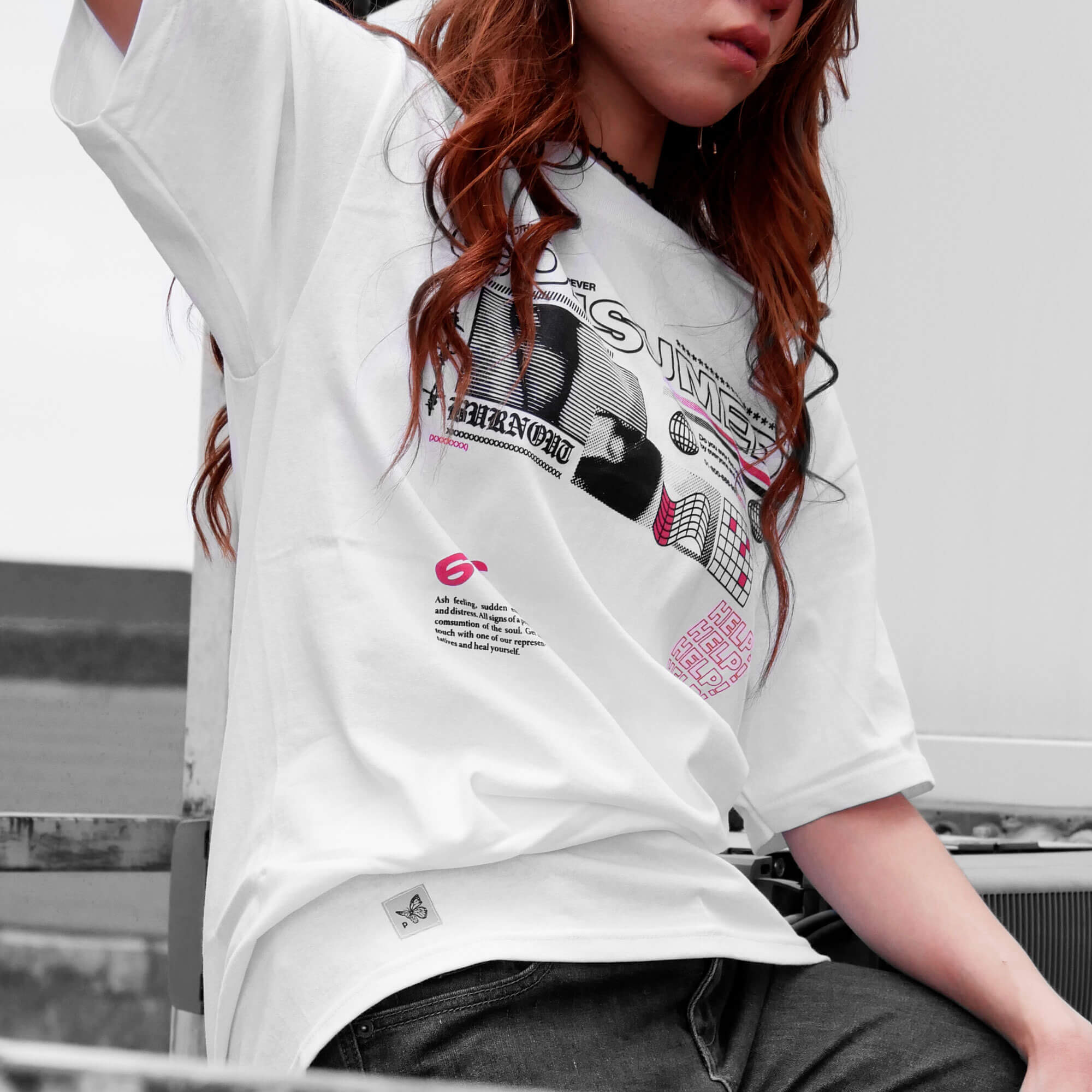 Angle view of model wearing CONSUMED white t-shirt from PHOSIS Clothing
