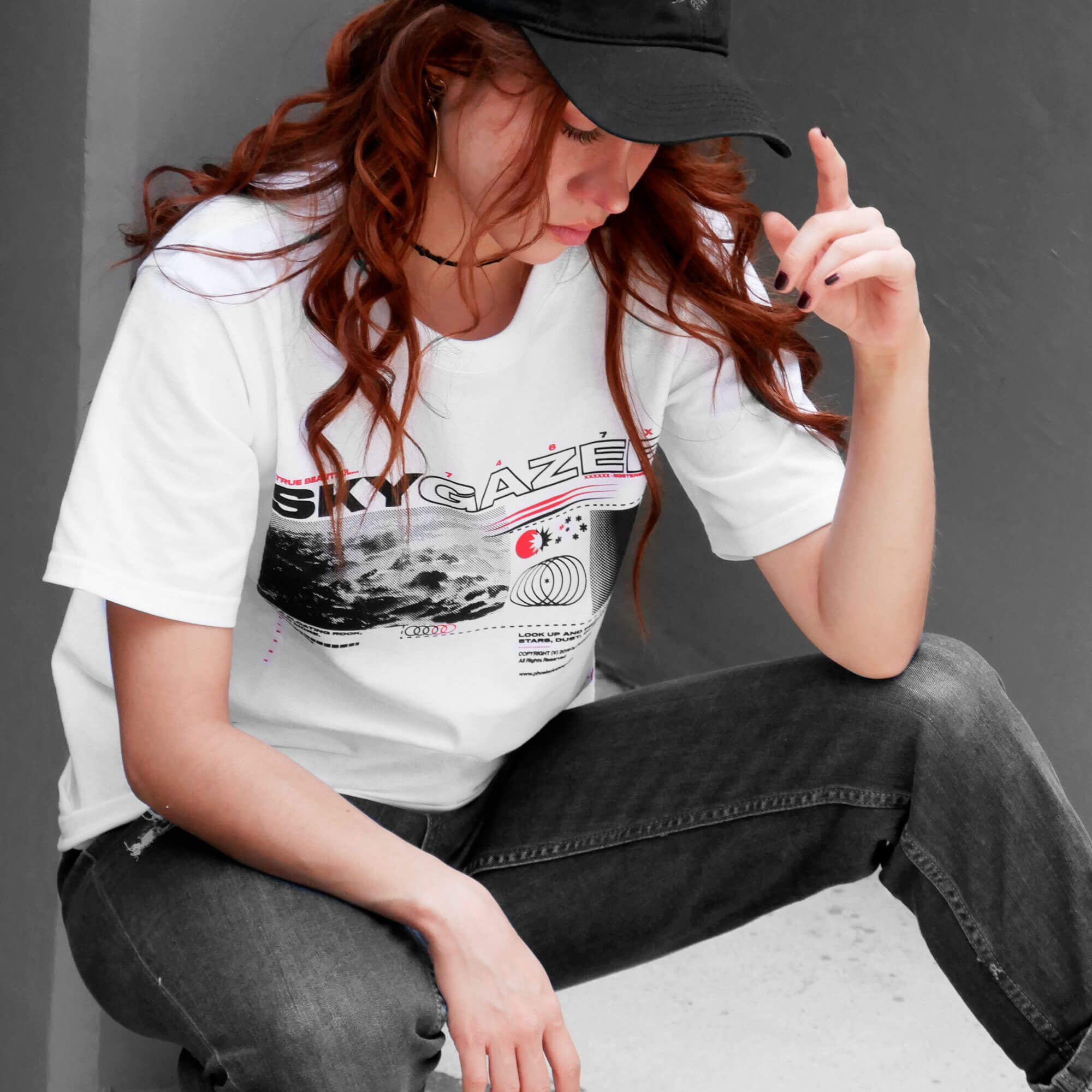 Angle view of model wearing SKYGAZER white t-shirt from PHOSIS Clothing