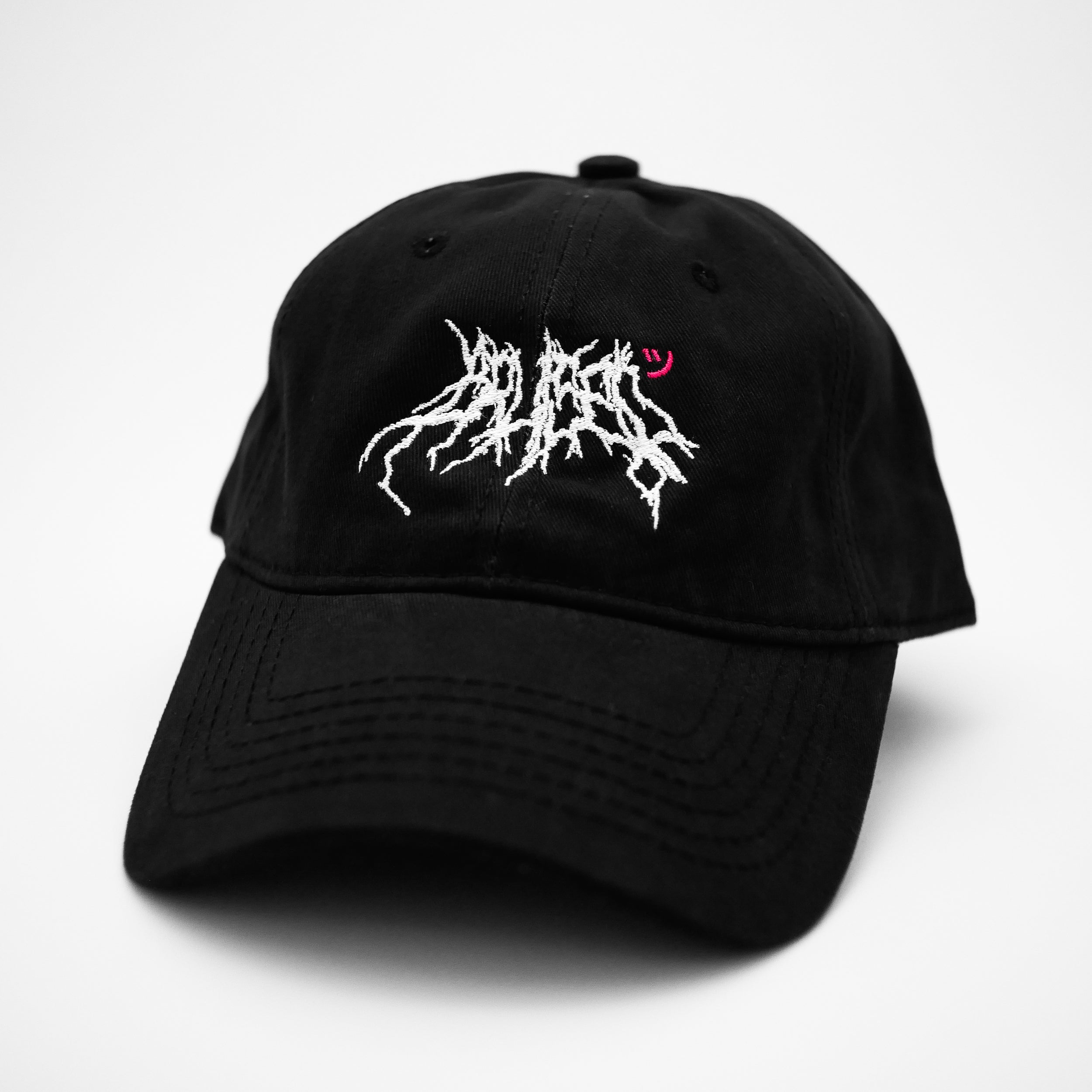 Angle view of the embroidered BRUISED black dad hat from PHOSIS® Clothing