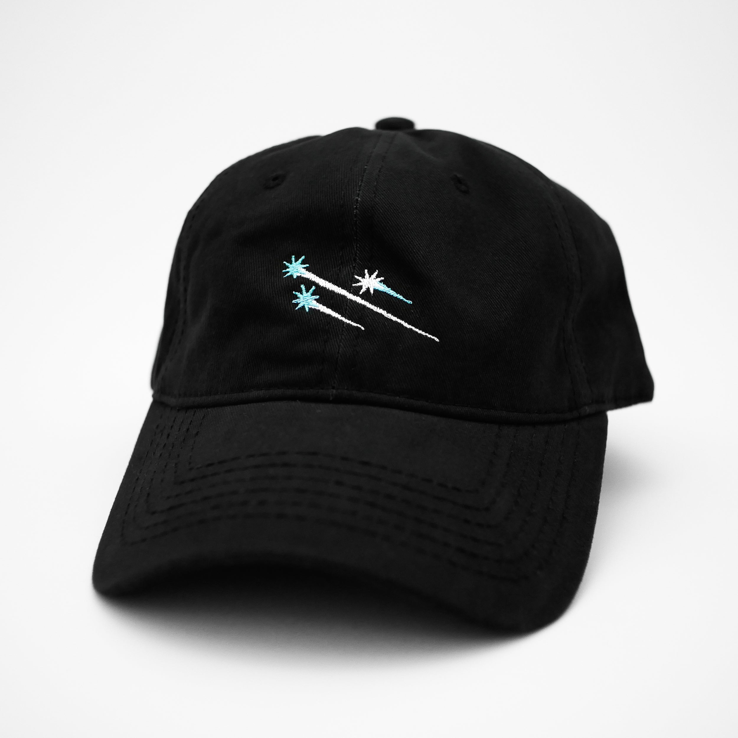 Angle view of the embroidered ÉTOILE black dad hat from PHOSIS® Clothing