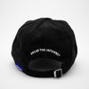 Load image into Gallery viewer, Back view of the embroidered OLD ENGLISH &quot;PHOSIS&quot; black dad hat from PHOSIS® Clothing