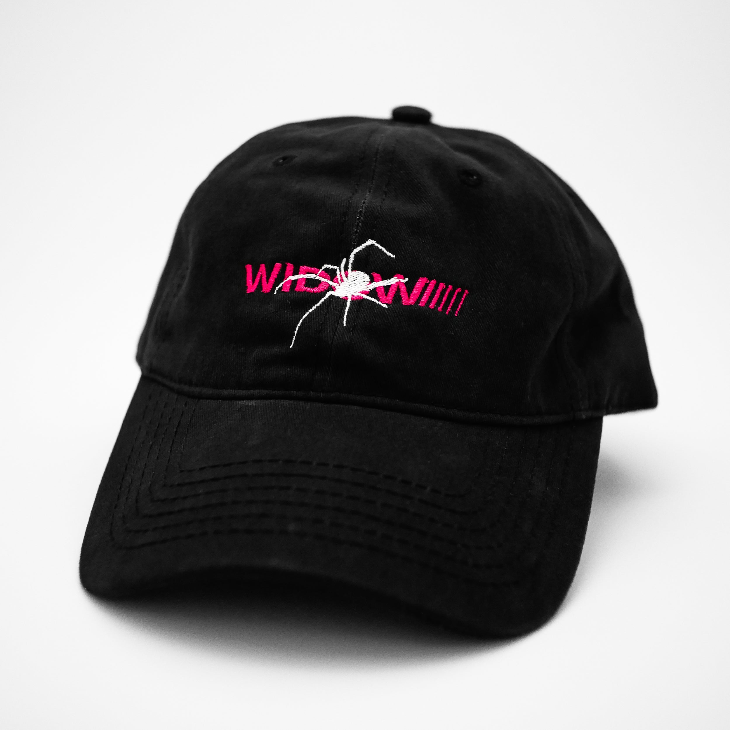 Angle view of the embroidered WIDOW black dad hat from PHOSIS® Clothing